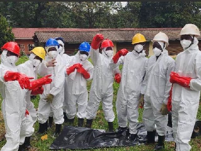 Decontamination crew in full PPE