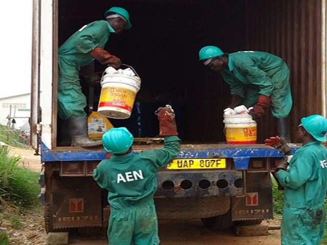Crew loading waste for disposal